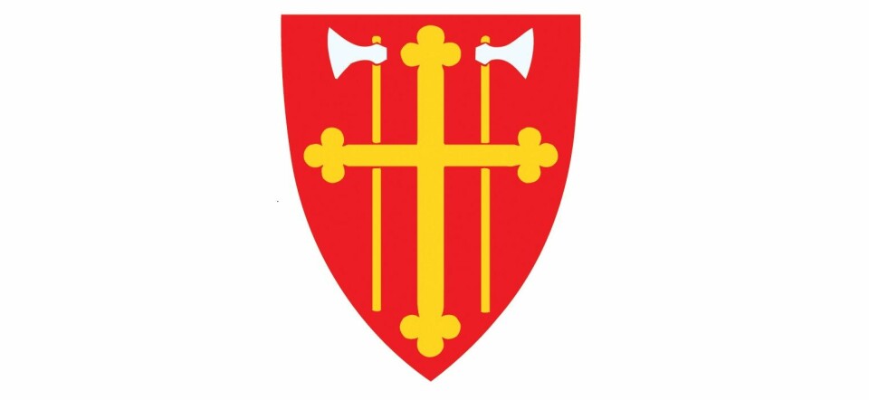 Våpenskjoldet til Den norske kirke i rødt, gult og hvitt