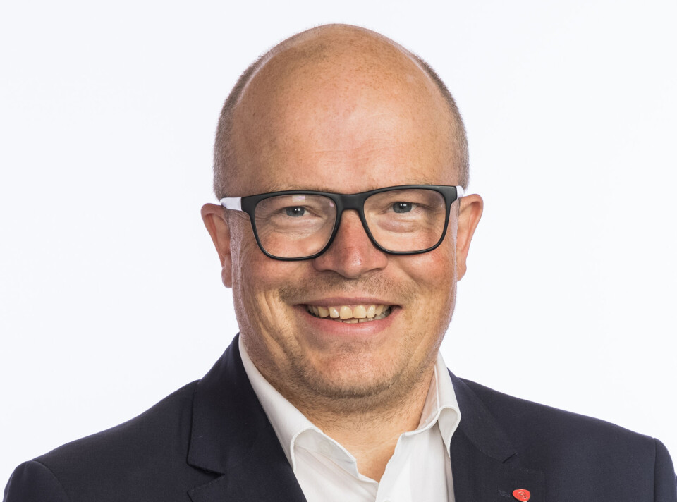 Per Vidar Kjølmoen. Mann med hvit skjorte og dressjakke.