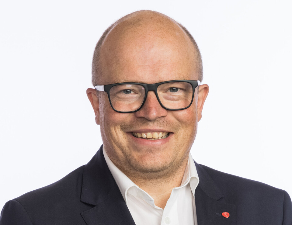 Per Vidar Kjølmoen. Mann med hvit skjorte og dressjakke.