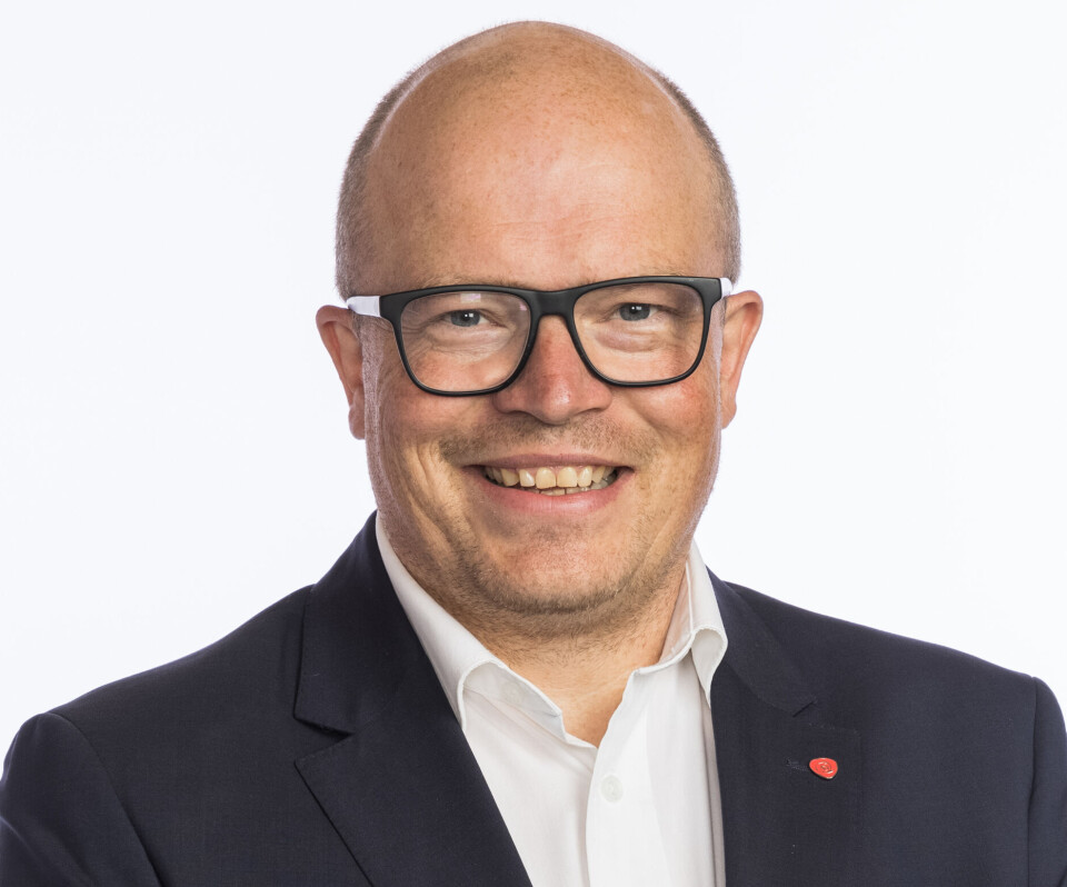 Per Vidar Kjølmoen. Mann med hvit skjorte og dressjakke.