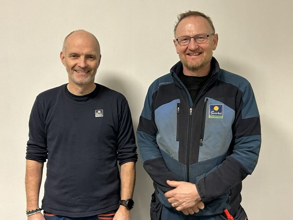 Per Olav Hoem og Lars Arne Gjeldnes. To smilende menn i arbeidsklær.