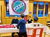 ØSIL stand med to damer bak og en gutt som snakker med dem