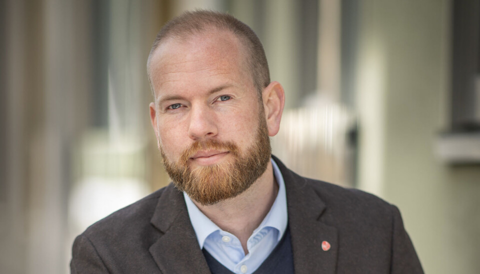 Isak V. Busch mann med brun dressjakke