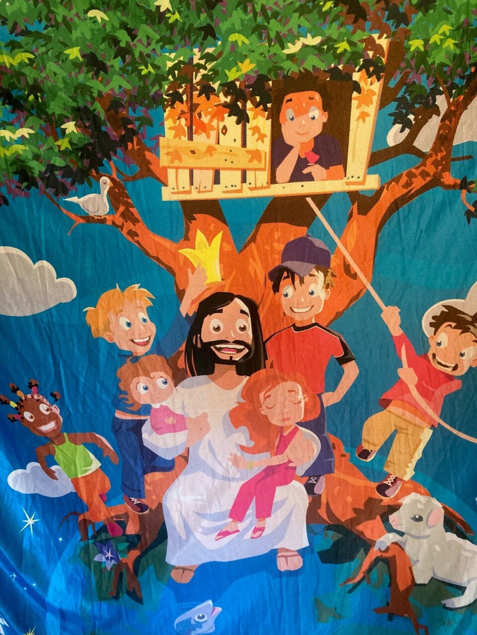 Barneforening på Rindal menighetshus Teppe med bilde av jesus med barn